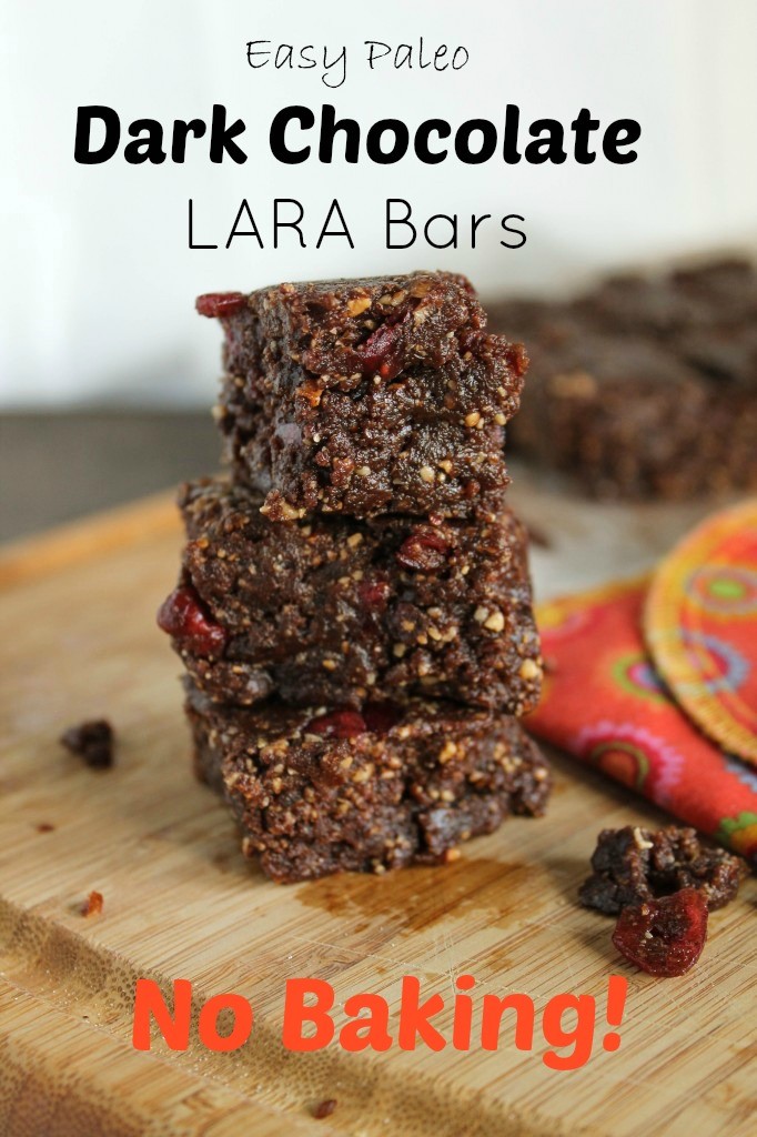 3 stacked dark chocolate nut and date bars with cranberries on a wooden cutting board and a text overlay