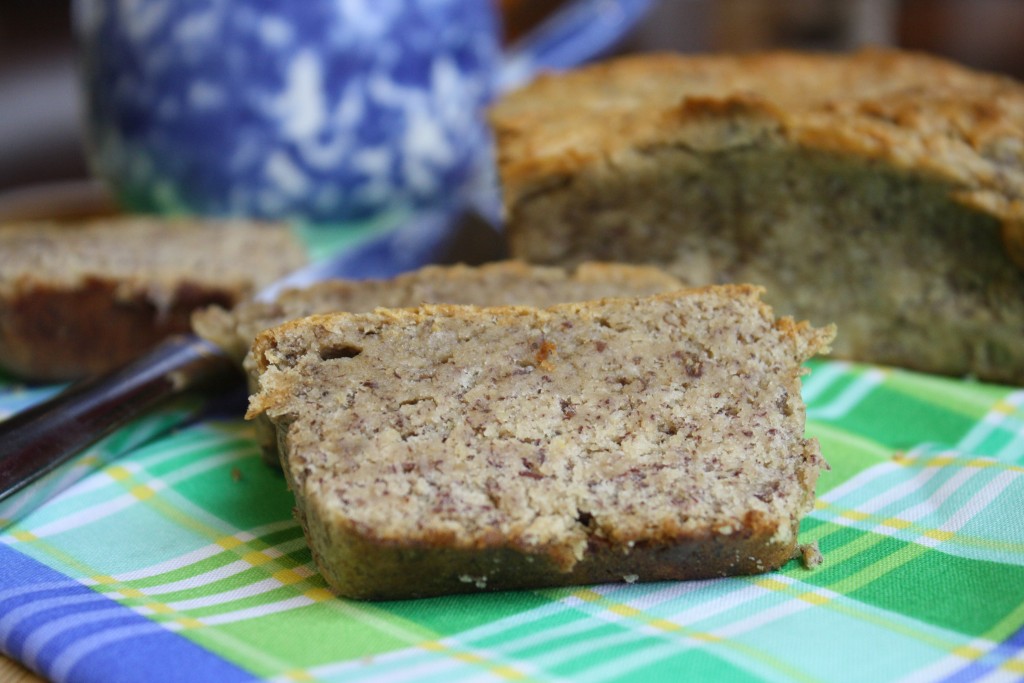 banana bread slices atop and lime and cobalt blue linen from eye level