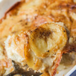 a scoop of creamy dairy free scalloped potatoes over the main dish