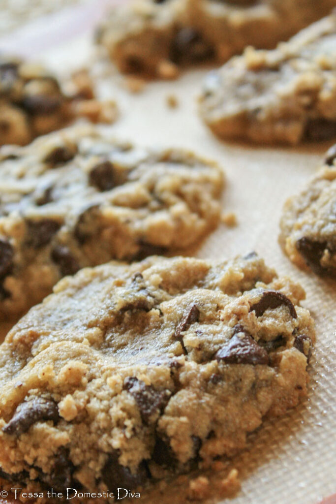 close up of chocolate chip cookies on a non stick baking mat