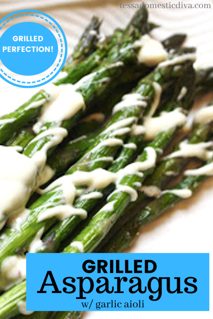 pinterest ready grilled asparagus on a white plate with a mayo drizzle looking from above