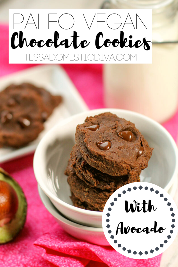 pinterest ready chocolate chip studded avocado cookies atop a white serving bowl with a pink backdrop