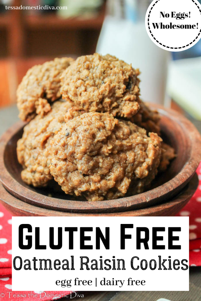 pinterest ready two stacked wooden bowls filled with cinnamon and raisin oatmeal cookies on a red cloth with a glass of milk