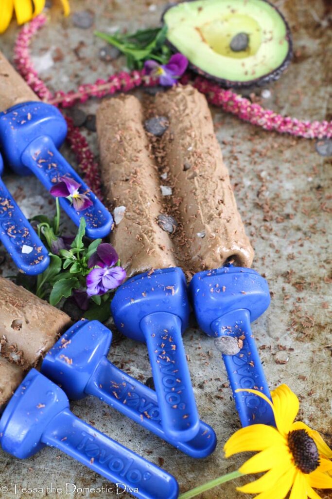 a few chocolate pops with flowers and avocado