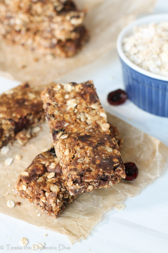 two no bake granola bars on apiece of parchment.
