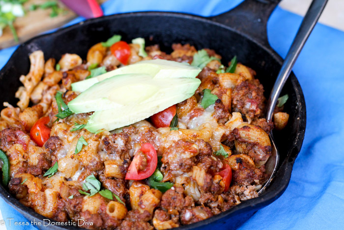 a pan filled with macaroni, hamburger in a tomato chili sauce