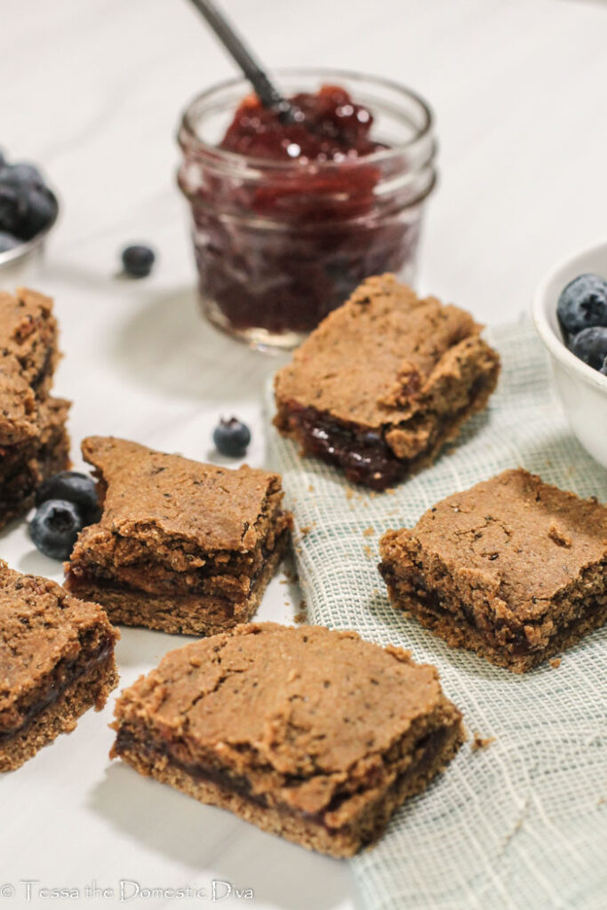 several squares of homemade cereal bars filled with fruit