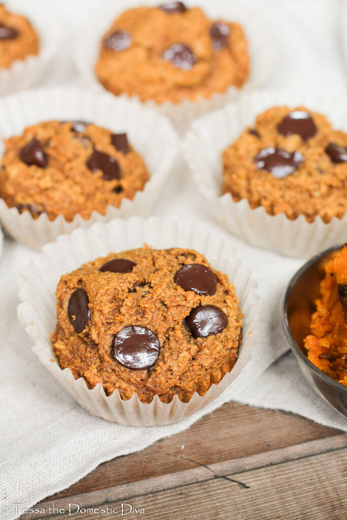 an arrangement of pumpkin muffins on a linen napkin