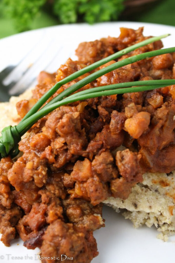 eye level view of a beef, bacon, barbecue, and pinto bean skillet meal