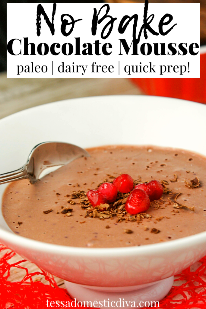 pinterest ready white bowl filled with a thick chocolate mousse and topped with chocolate shavings and red pomegranate seeds