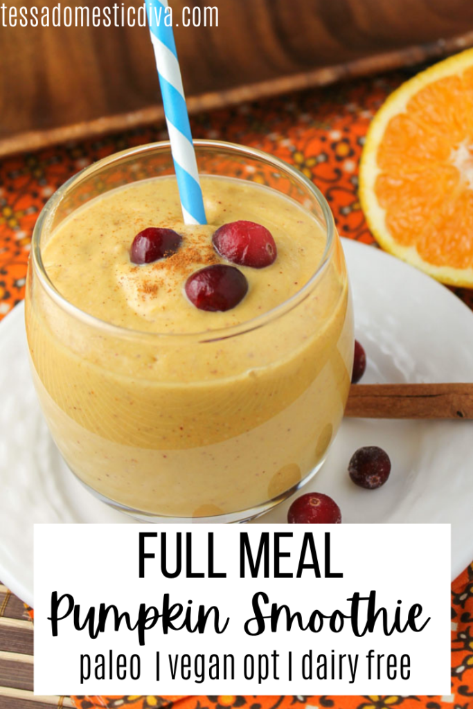 pinterest ready glass of pumpkin smoothie with fresh cranberry and orange and cinnamon