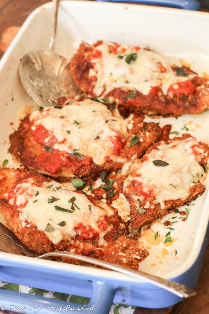 4 pieces of crispy breaded chicken pieces with melted cheese, tomato sauce, and oregano