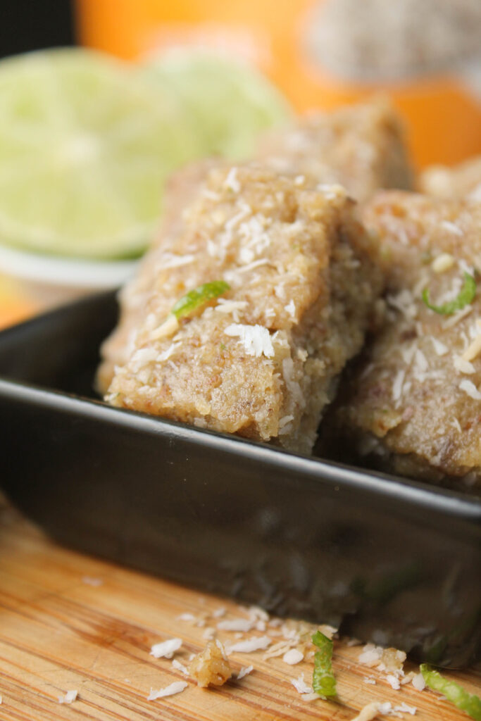 a black square dish with rectangle shaped homemade power bars.