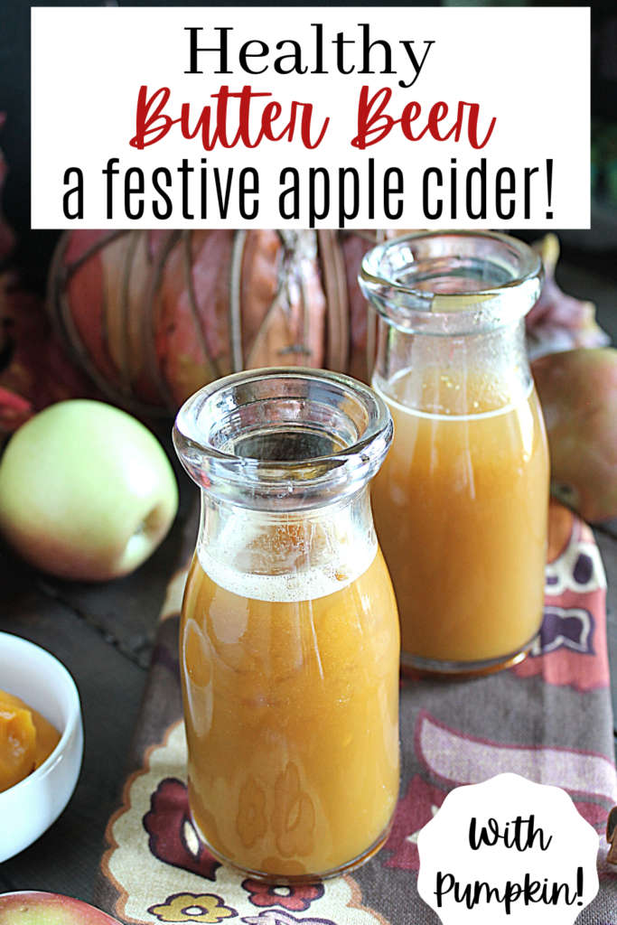 pinterest ready two glasses of apple cider with pumpkin, fresh apples, on a dark wooden surface