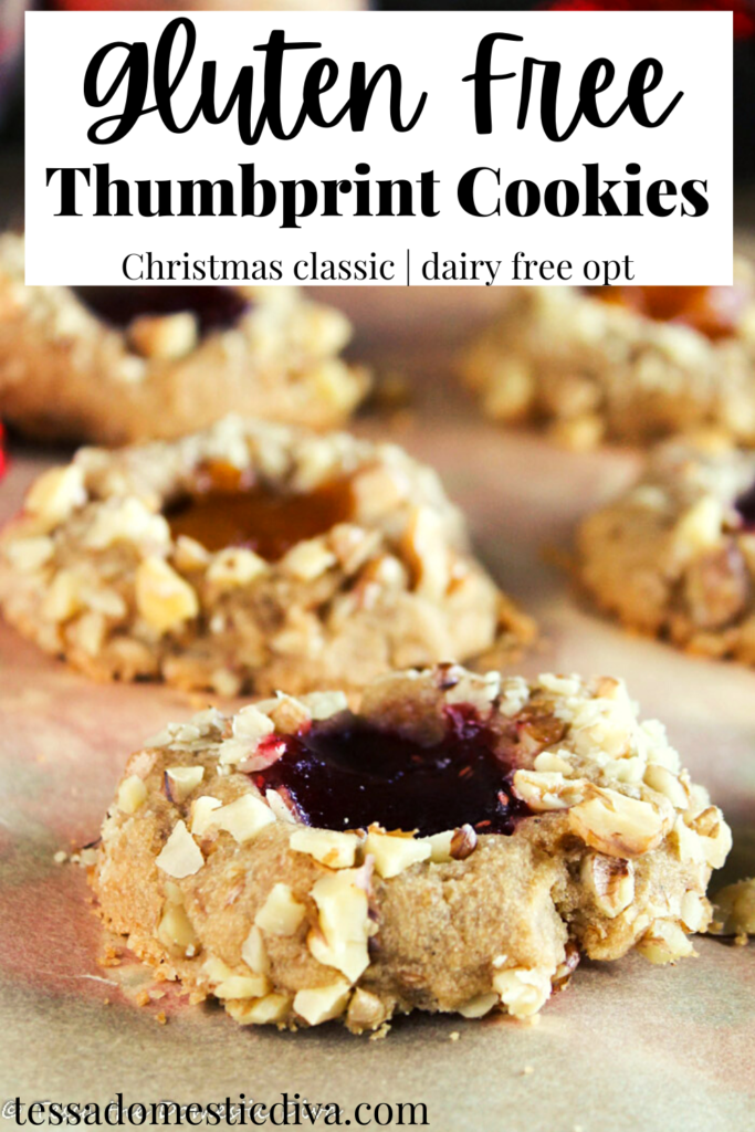 pinterest ready close up of a column of thumbprint cookies filed with red and orange jellies and coating in finely diced walnuts