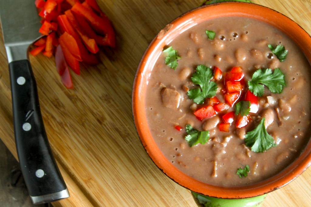 overhead picture of best pinto bean recipe in the pressure cooker on a bamboo cutting board