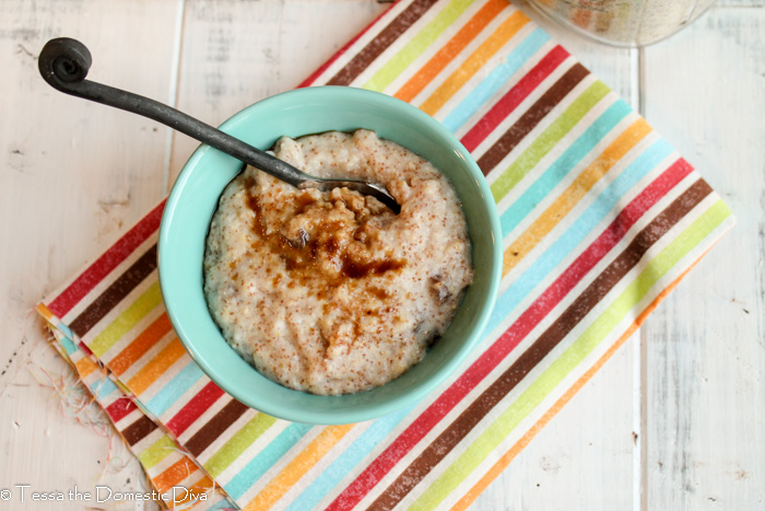 birds eye view of a blue bowl of gluten free cream of wheat cereal topped with cinnamon