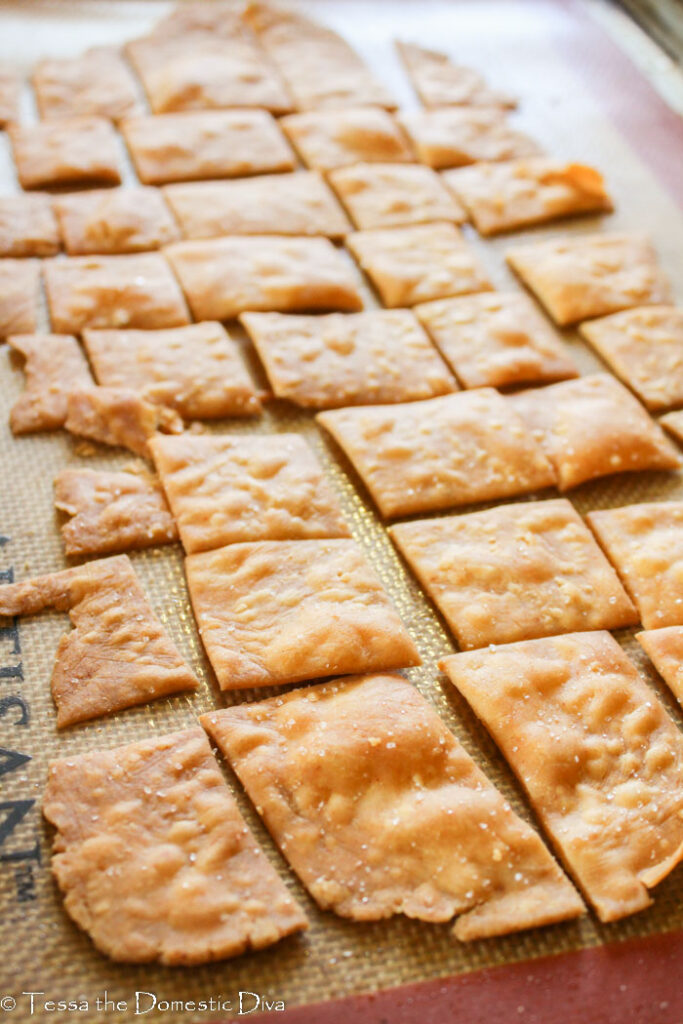 crispy bubbling homemade crackers on a baking sheet