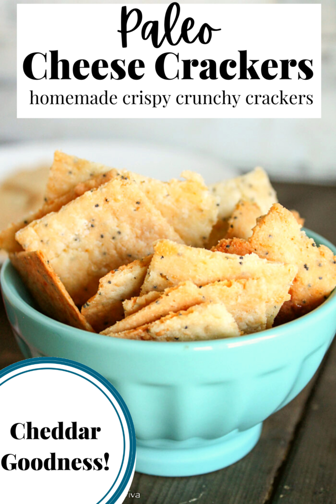 pinterest ready bowl of cheese filled crackers on a dark wood surface