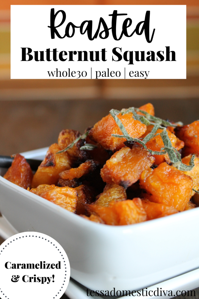 pinterest ready caramelized cubes of roasted butternut squash with a chiffonade of sage in white bowl