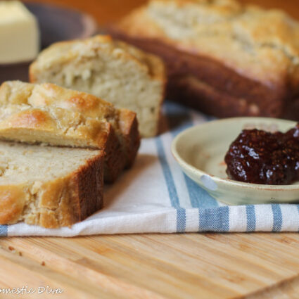 eye level close up of sliced low carb bread with butter and berry spread