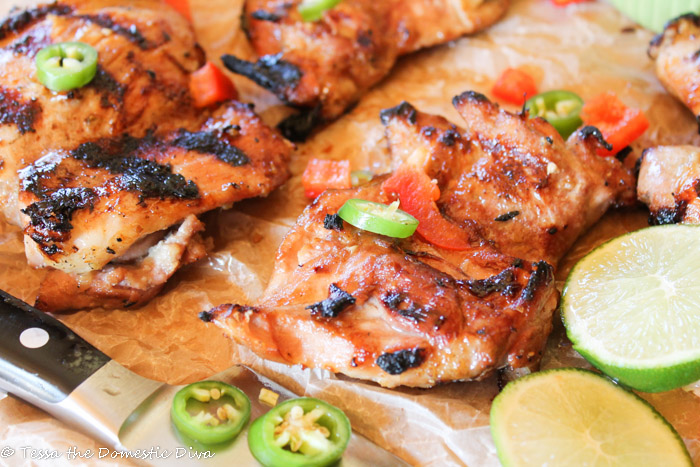 grilled bneless chicken thighs topped with red peppers, jalapeños, and fresh lime slices