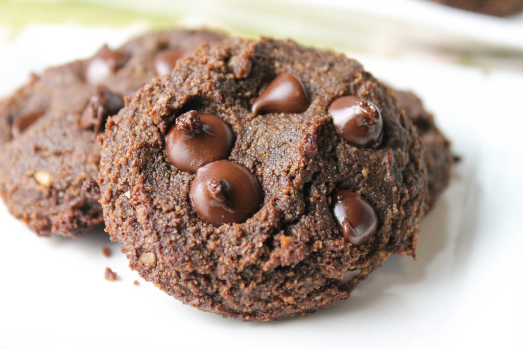 close up of double chocolate cookie on a white plate.