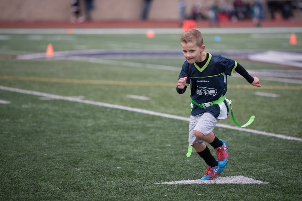 7 year old running on football field