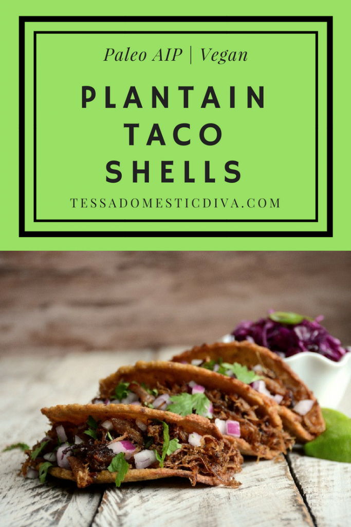 optimized for pinterest three crispy plantain taco shells filled with carnitas cilantro and purple cabbage arranged on a white-washed board.