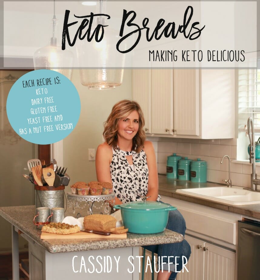 cookbook cover image for keto breads cookbook author standing in kitchen .