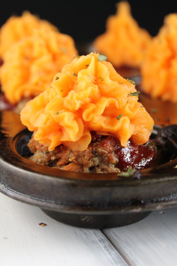 eye level of a cupcake shaped meatloaf with sweet potato 'frosting.'