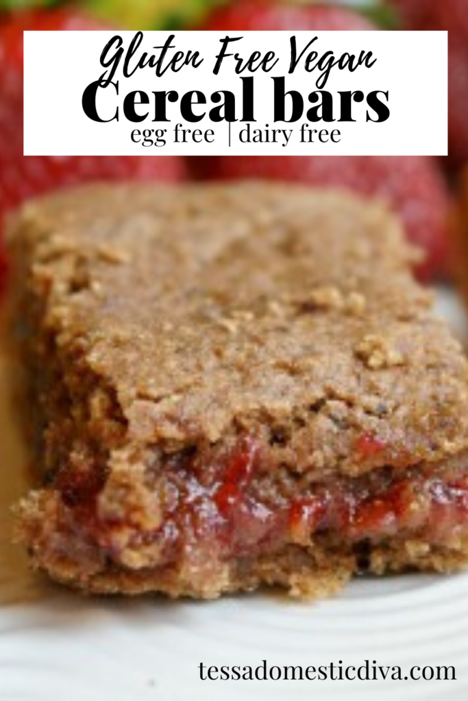 pinterest ready close up of a strawberry filled homemade cereal bar cut up on a white plate