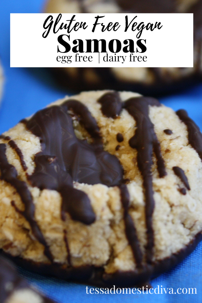 pinterest ready close up of a coconut cookie dipped in a chocolate coating