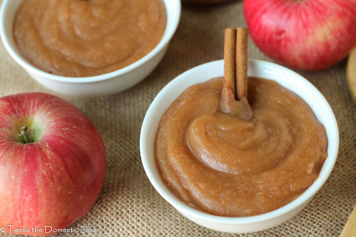 overhead view of two white bowls filled with homemade creamy applesauce