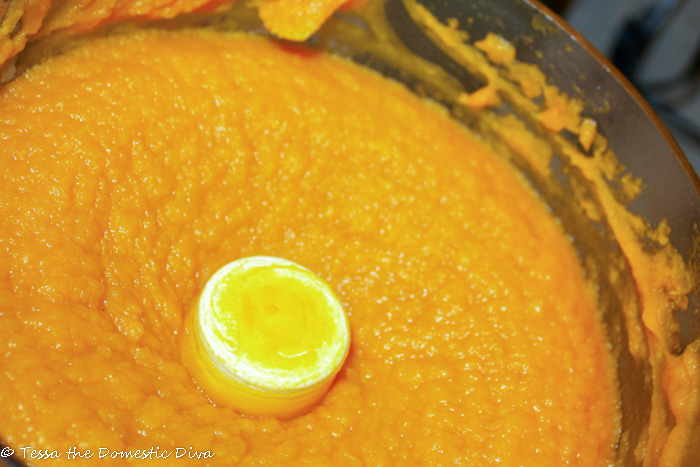pureed pumpkin flesh in the bowl of a food processor