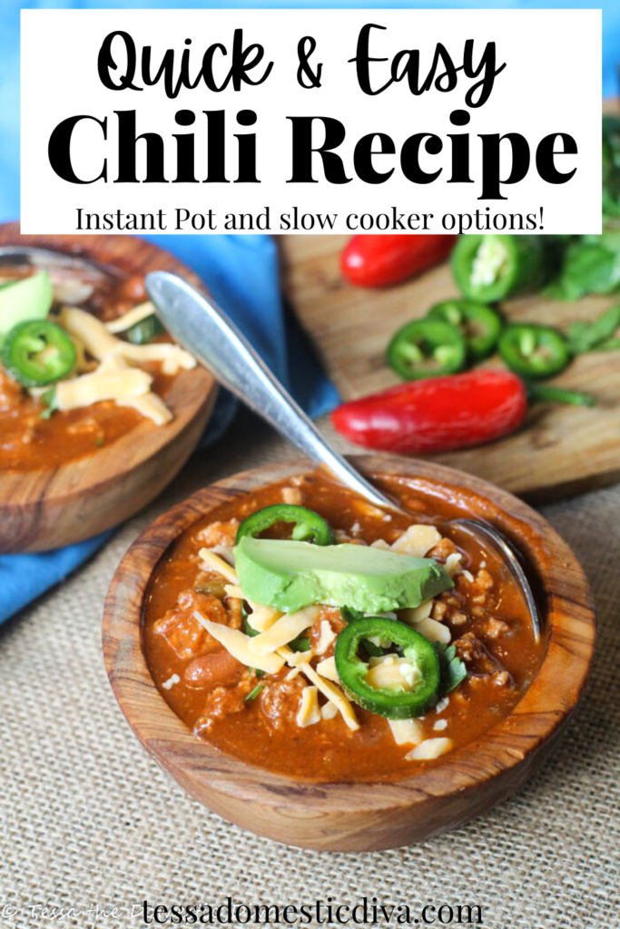 pinterest ready olive wood bowls filled with pinto bean and ground meat stew topped with sliced jalapenis and shredded cheddar cheese