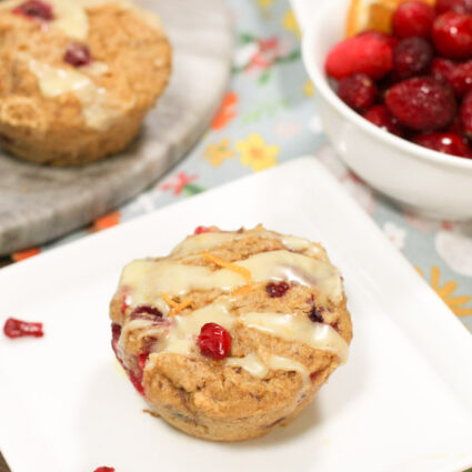 cranberry studded muffins with ornage zest and a creamy glaze