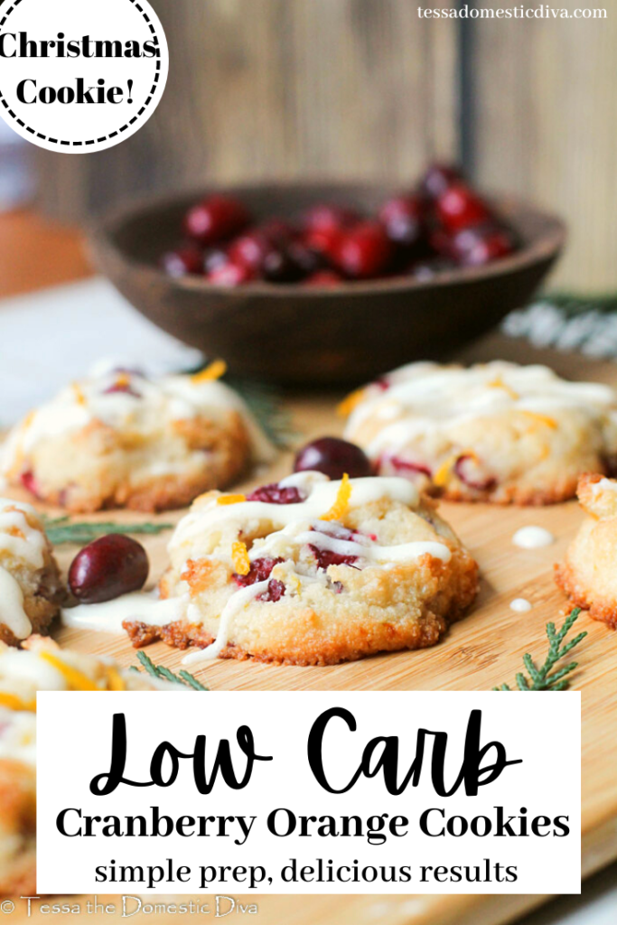 pinterest ready orange ookies on a wood cutting baord with fresh cranberries and orange zest